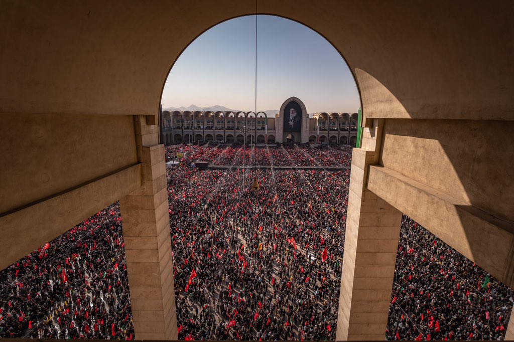 Wide aerial of the procession filling Tehran